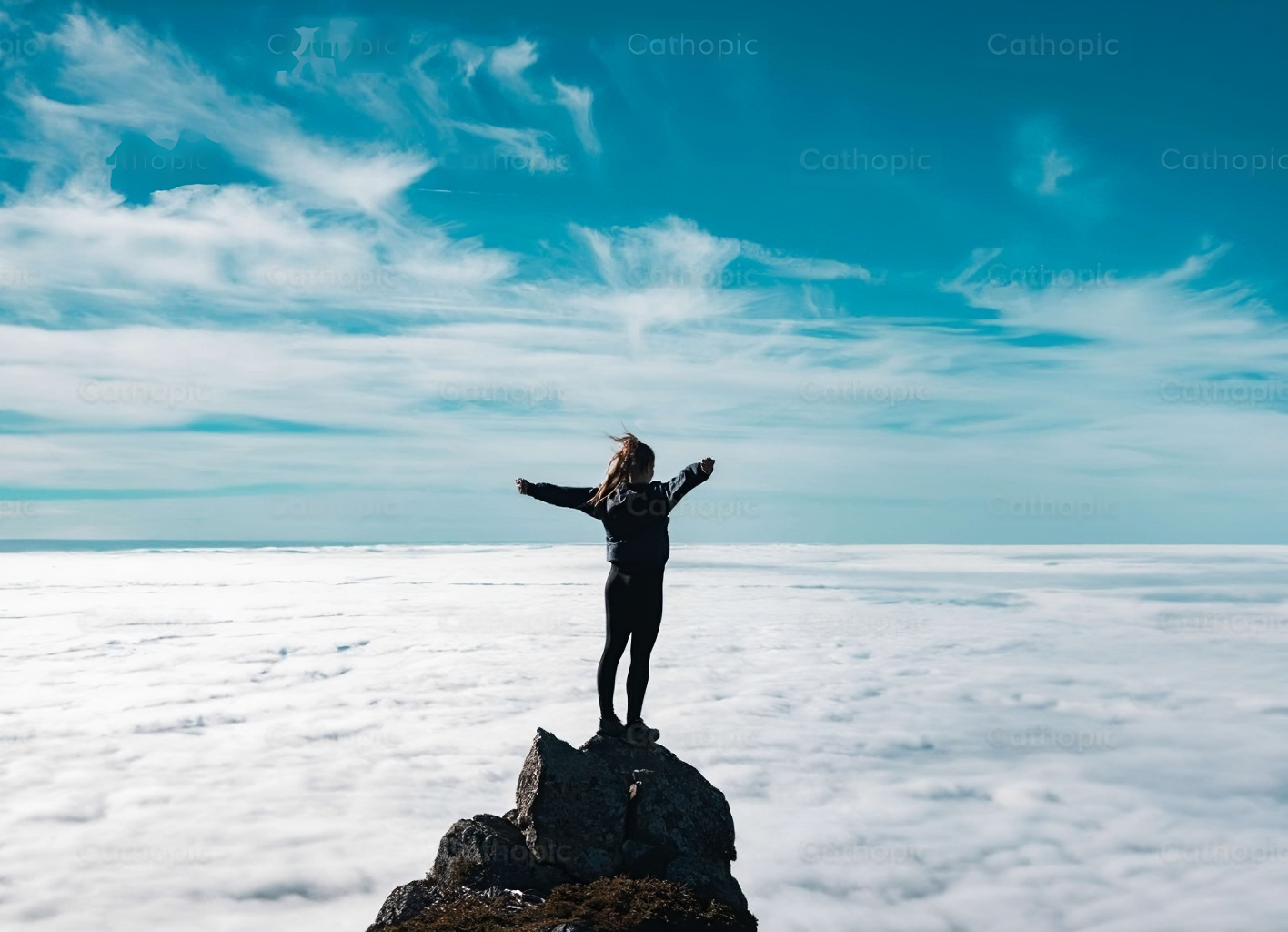 Hikin to the summit over the clouds.