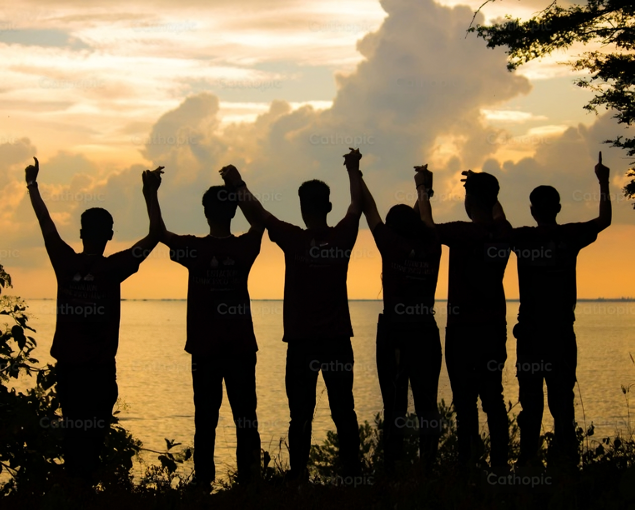 Young men holding hands.
