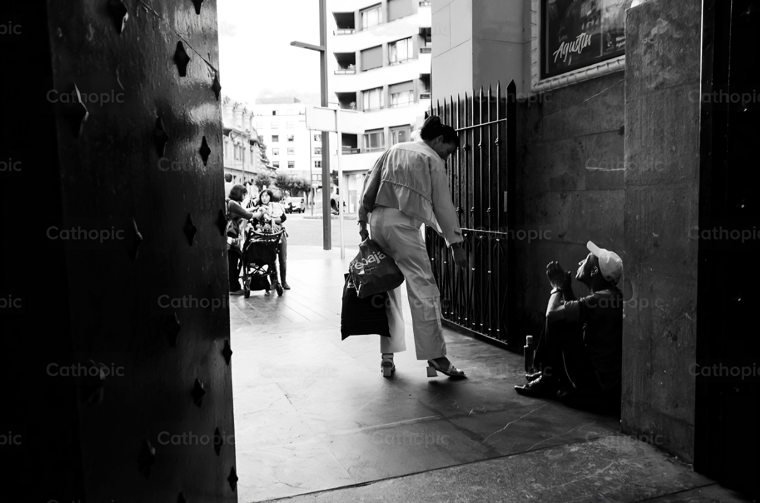 Woman giving charity on the street. Donation.