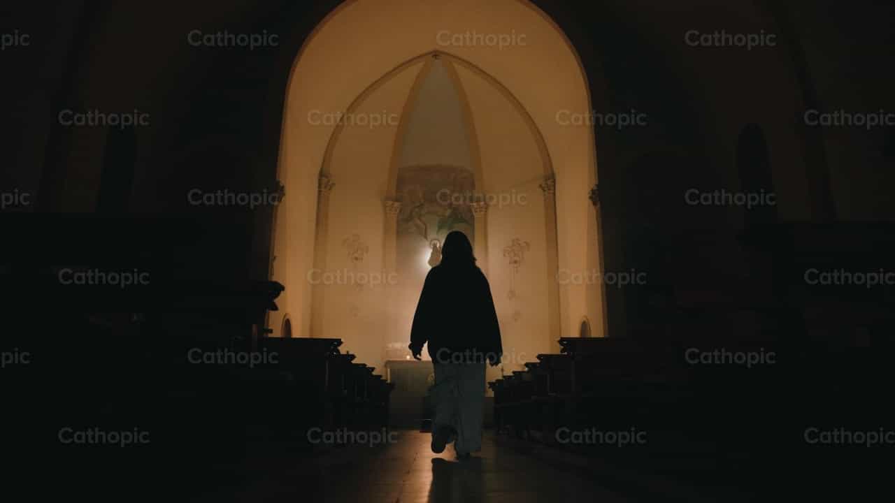 Young girl walking into a catholic temple - Catholic stock videos