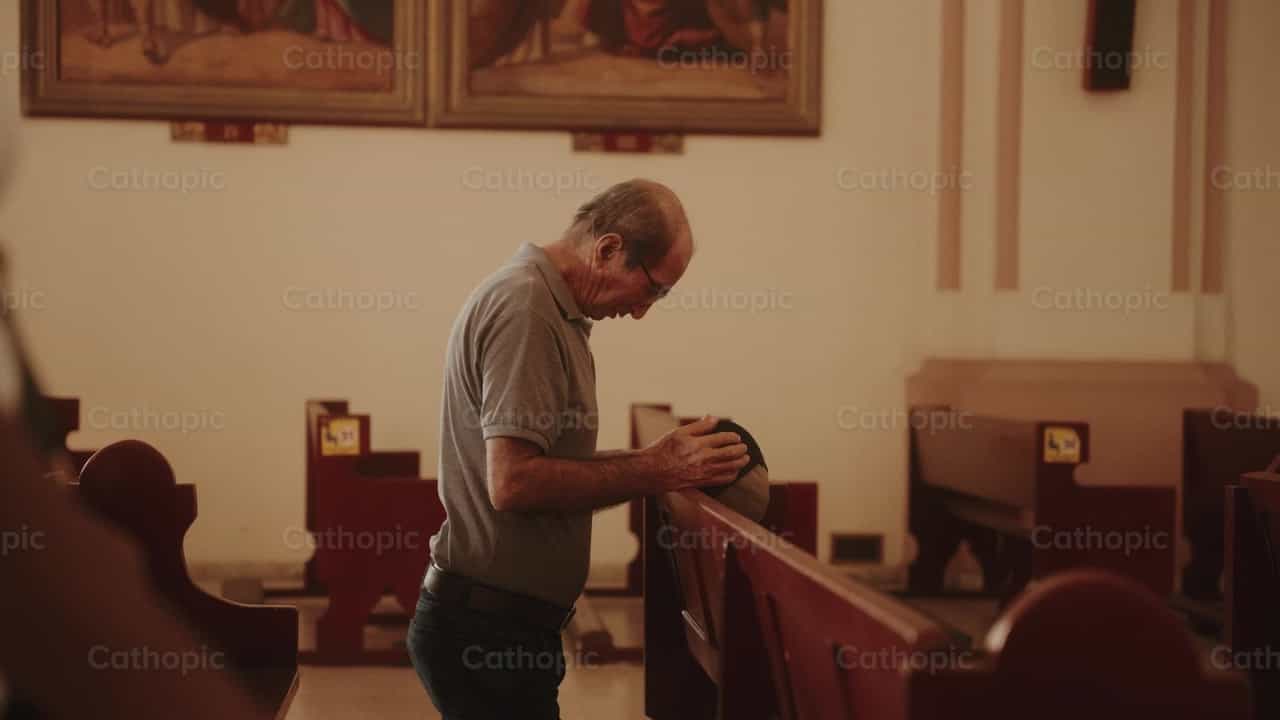 Man kneeling in the temple - Catholic stock videos - Photo by Carlos Gaviria