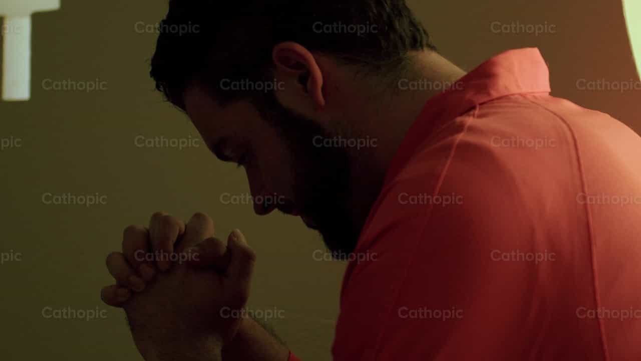 Prisoner before a crucifix - Catholic stock videos - Photo by Almures Studio