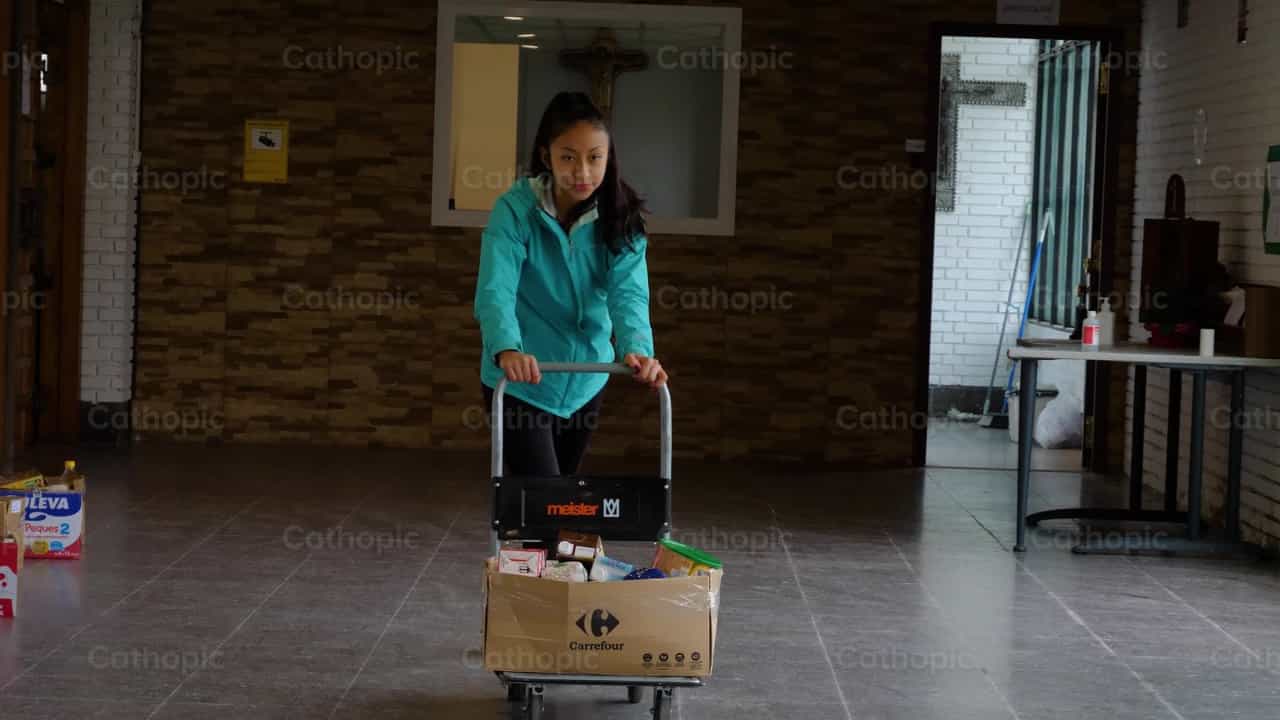 Girl Carrying Food Cart - Catholic stock videos - Photo by Cathopic