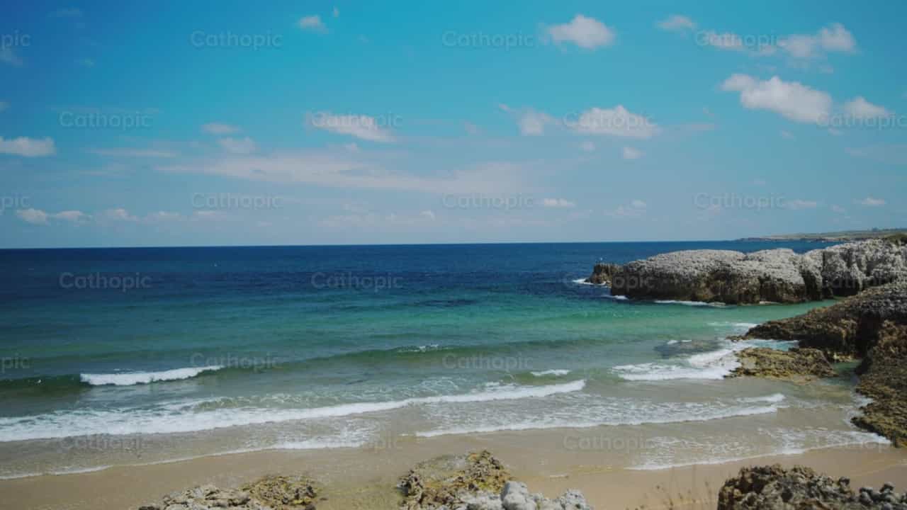 Beautiful beach with rocks - Catholic stock videos - Photo by Catholic Stuff