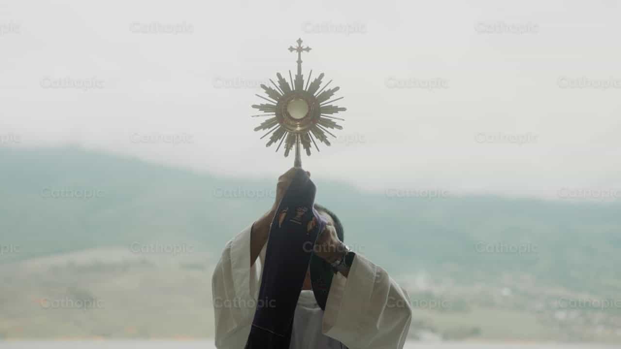 Priest gives blessing with the Blessed Sacrament - Catholic stock videos
