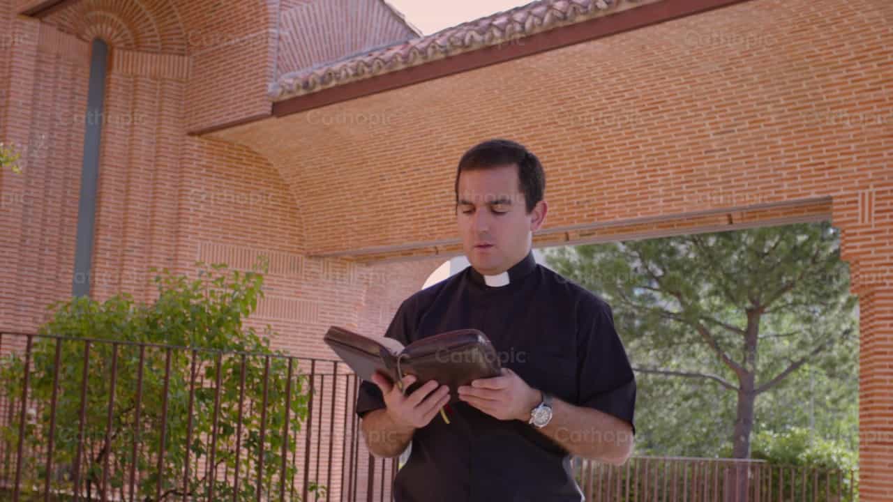 Priest walking and meditating - Catholic stock videos