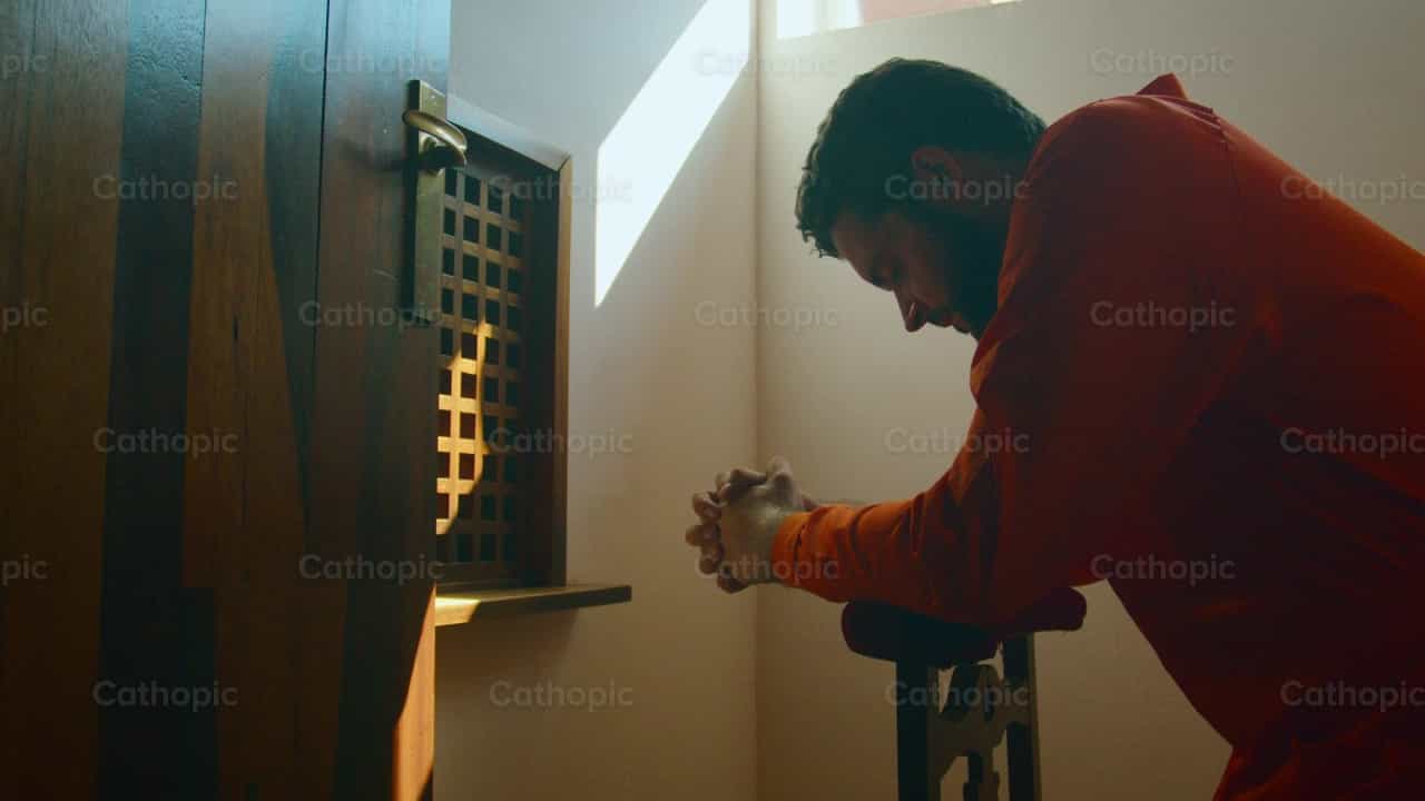 Prisoner confessing his sins - Catholic stock videos - Photo by Almures Studio