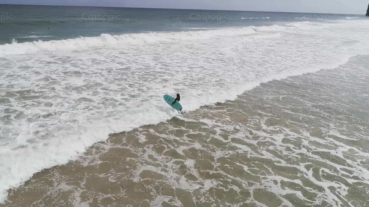 Lonely surfer - Catholic stock videos - Photo by Iván W. Jaques