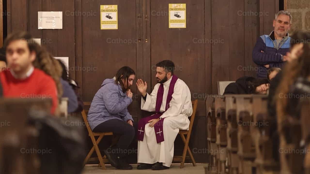Priest listens to and absolves a young penitent - Catholic stock videos - Photo by Yandry Fernández Perdomo