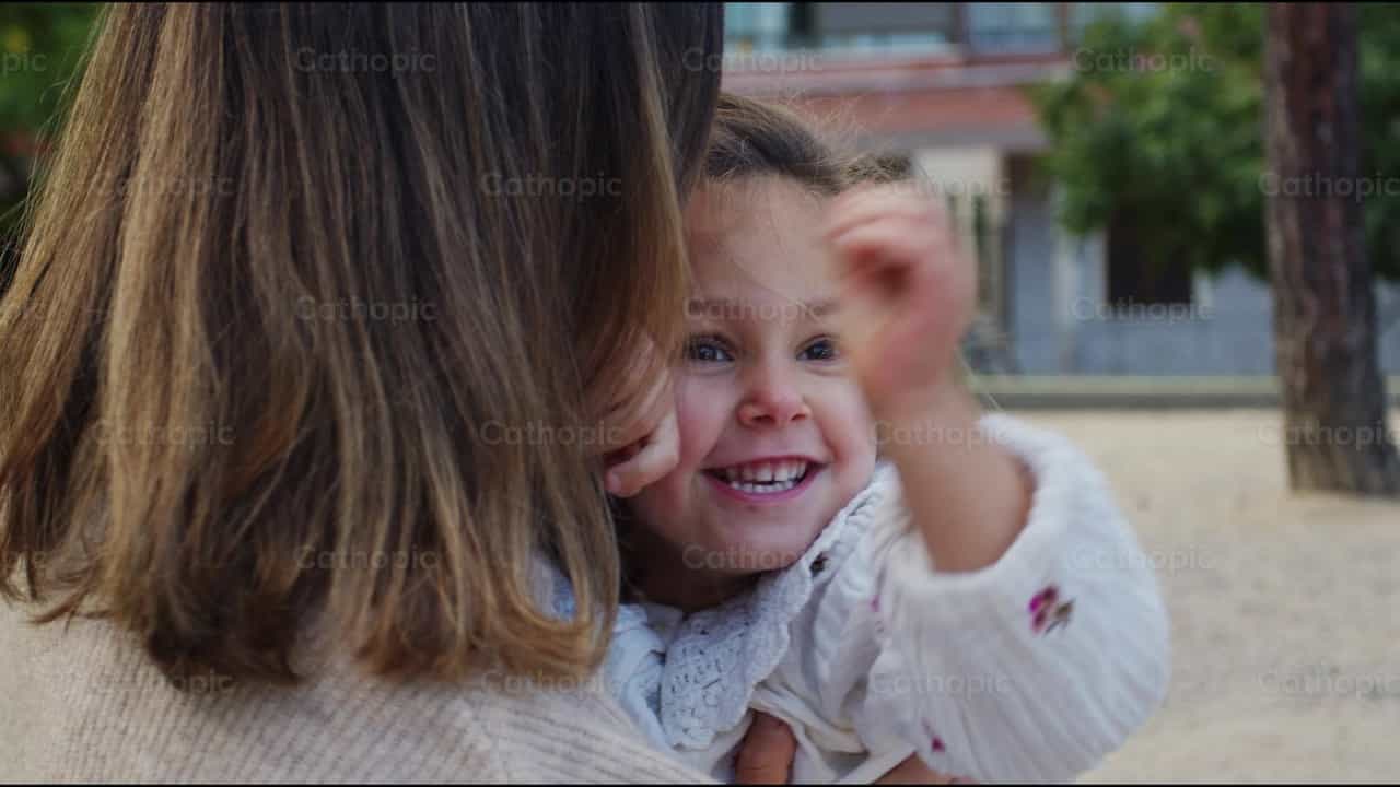Tender embrace between mother and daughter - Catholic stock videos - Photo by Almures Studio