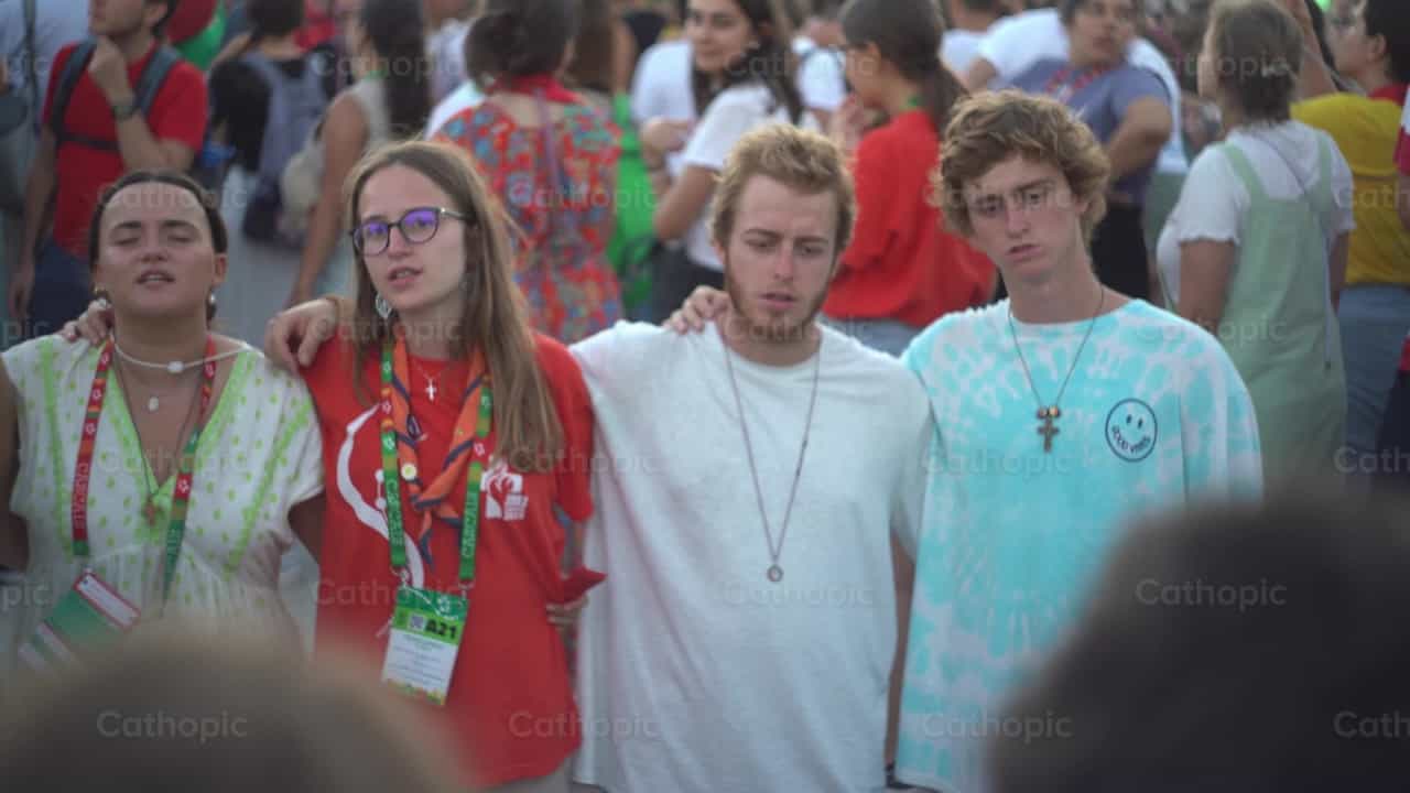Boys and girls praying on their knees singing - Catholic stock videos - Photo by Lupe Belmonte