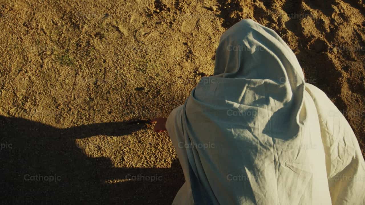 Jesus writes in the sand - Catholic stock videos - Photo by Almures Studio