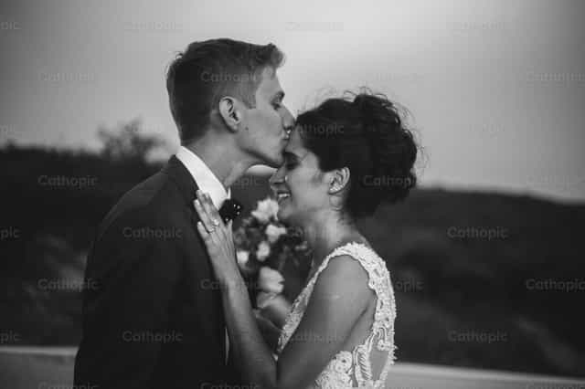 Showing love to his wife - Catholic stock images
