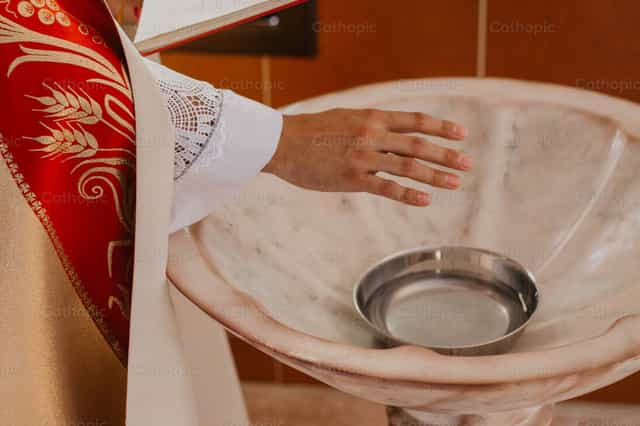 God bless this water - Catholic stock images