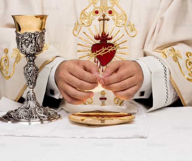 Breaking bread - Catholic stock images
