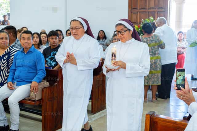 Nuns in the entrance procession at Mass - Catholic stock images - Photo by Hein Palma