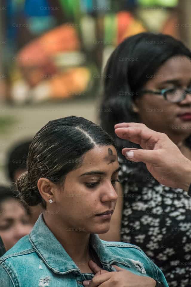 Women receiving ashes - Catholic stock images