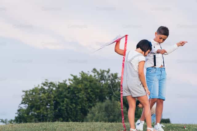 Playing with kites - Catholic stock images