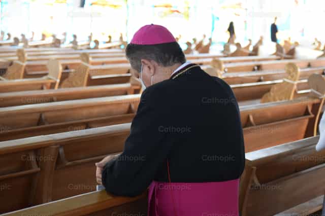 Bishop praying - Catholic stock images