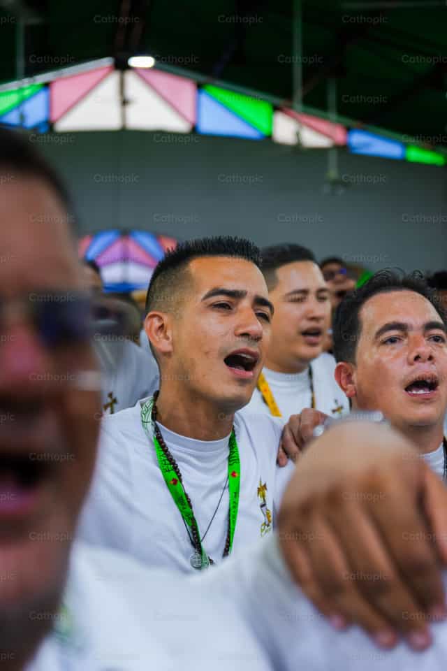 Praising God with my brothers - Catholic stock images - Photo by Miguel White