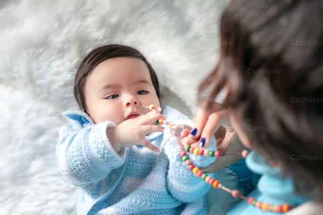 Baby and Rosary - Catholic stock images - Photo by Clina CG