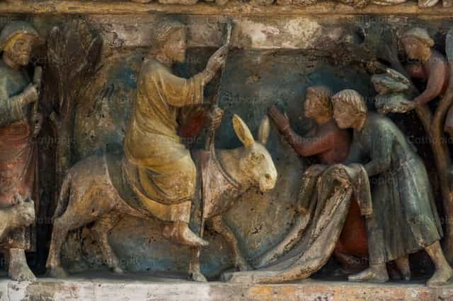 Jesus enters Jerusalem on a donkey, welcomed with palm branches - Catholic stock images - Photo by Joan Sutter