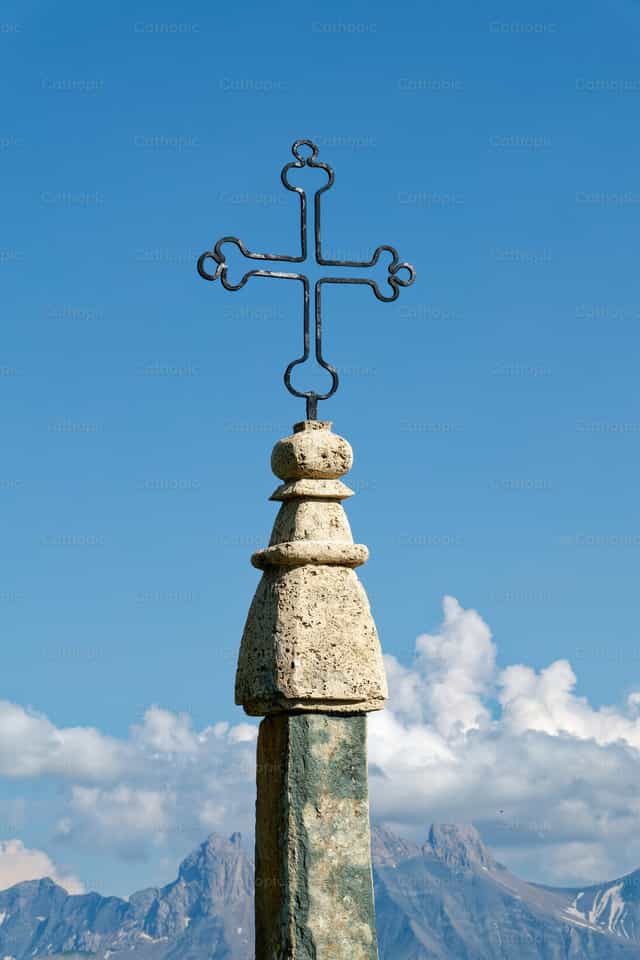 Mountain cross with blue sky - Catholic stock images - Photo by Joan Sutter