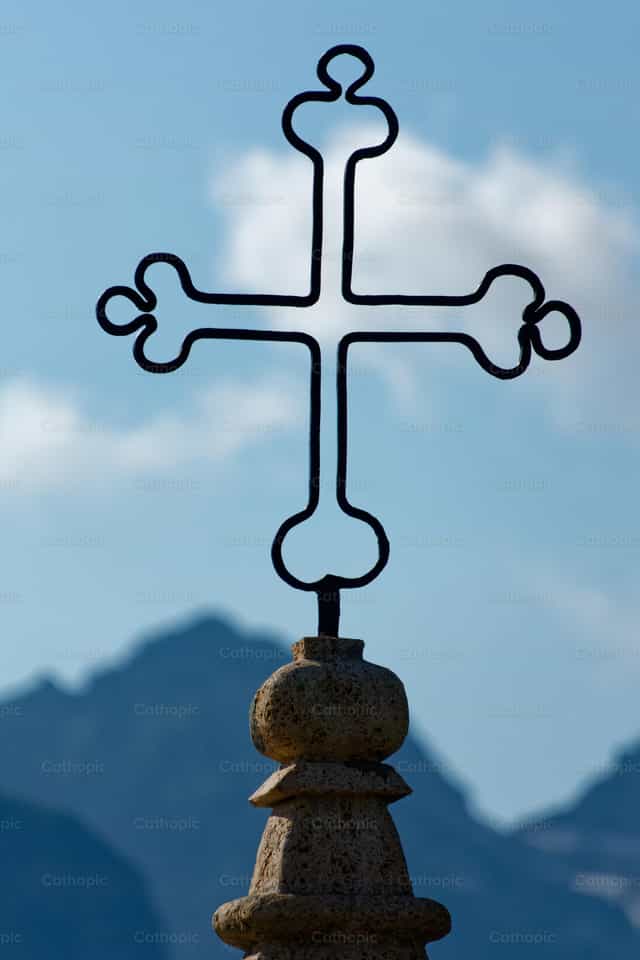 Mountain cross with blue sky - Catholic stock images - Photo by Joan Sutter