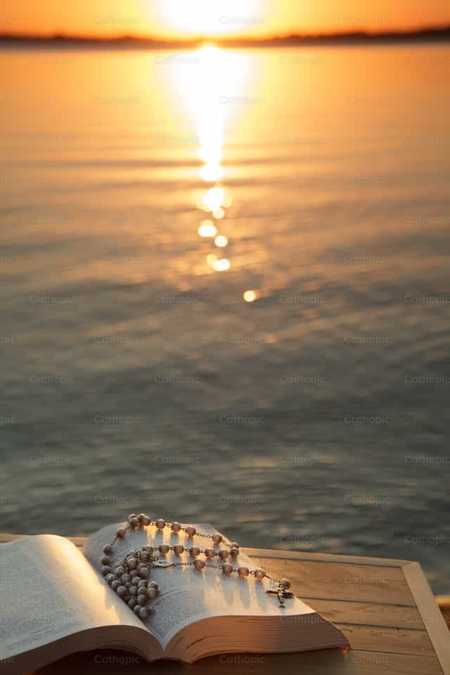 Rosary, Bible on the lake Waconia Minnesota - Catholic stock images - Photo by Vannett Studios