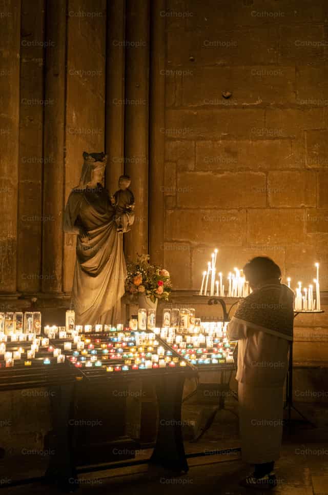 Prayer before Virgin Mary - Catholic stock images - Photo by Joan Sutter