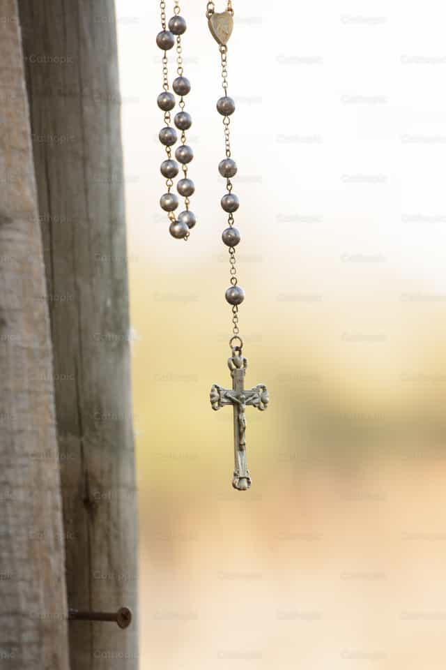 Rosary in the woods - Catholic stock images - Photo by Vannett Studios