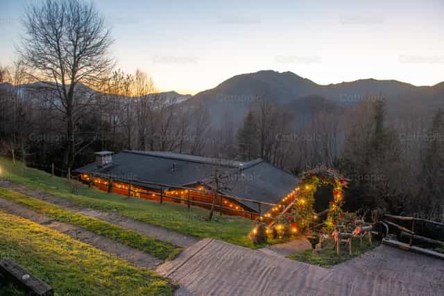 Wooden house illuminated at sunset - Catholic stock images - Photo by Pierluigi Palazzi