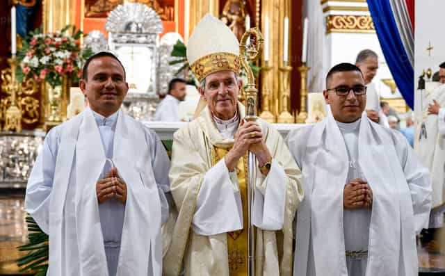 Bishop and deacons at the Chrism Mass - Catholic stock images