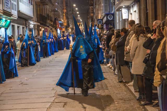A member of a religious brotherhood in a solemn procession - Catholic stock images - Photo by Yandry Fernández Perdomo