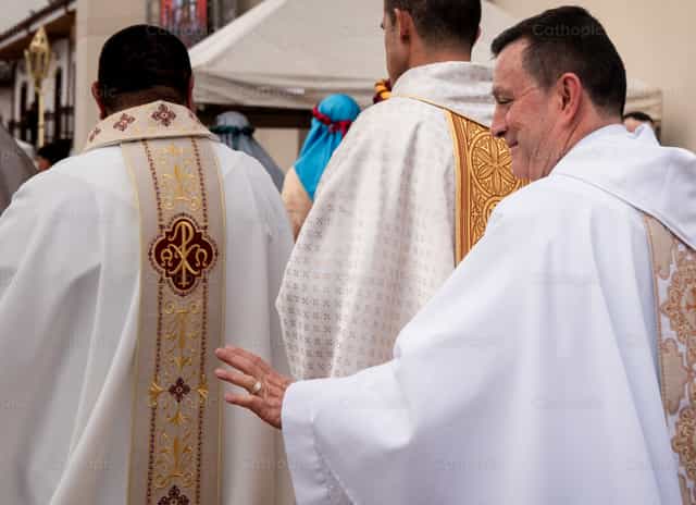 A group of priests and a priest waving - Catholic stock images - Photo by Carolina BR