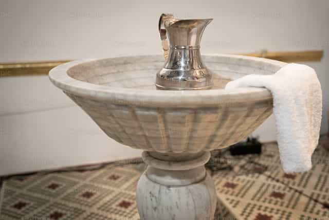 Marble baptismal font - Mga Catholic stock image