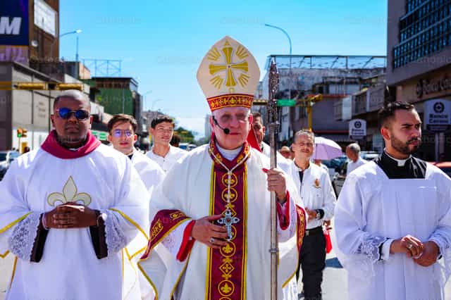 The bishop walking with the deacon and the master of ceremonies - Catholic stock images - Photo by Miguel White