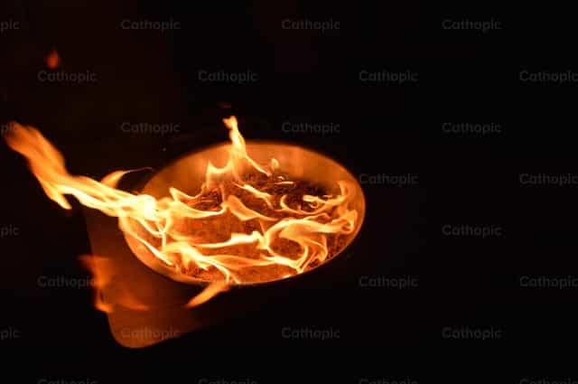 Fire lit for a liturgical celebration - Catholic stock images - Photo by Jose Conejo Saenz