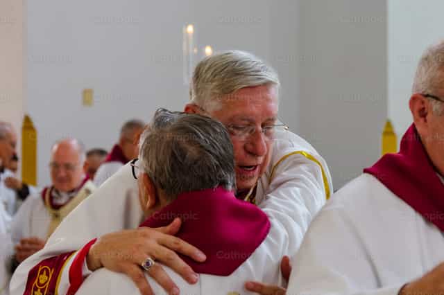 A hug between siblings - Catholic stock images - Photo by Miguel White