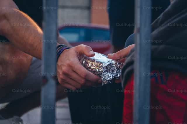 Feeding the hungry - Catholic stock images