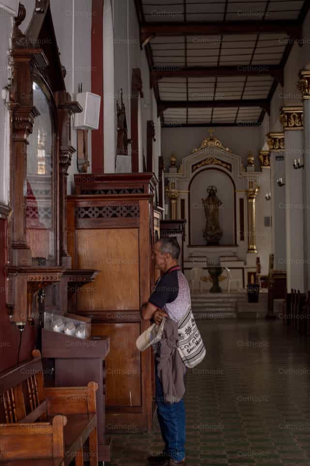 Man praying - Catholic stock images