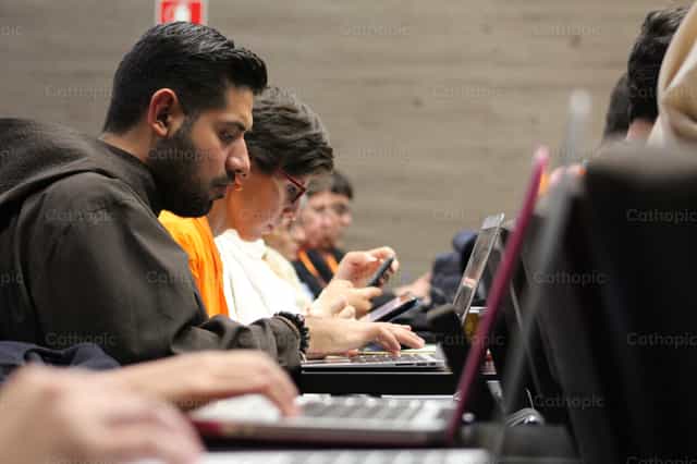 Working with technology - Catholic stock images