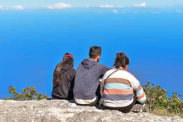 In prayer with a view of the landscape - Catholic stock images - Photo by Miguel White