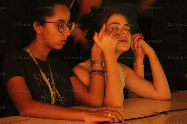 Friends praying with joined hands - Catholic stock images