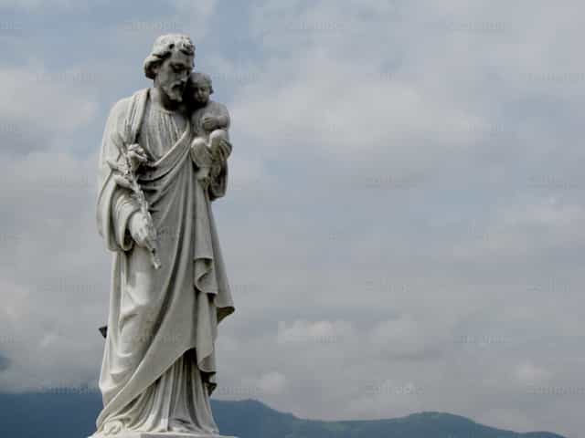 Sculpture of St. Joseph; at the cemetery - Catholic stock images