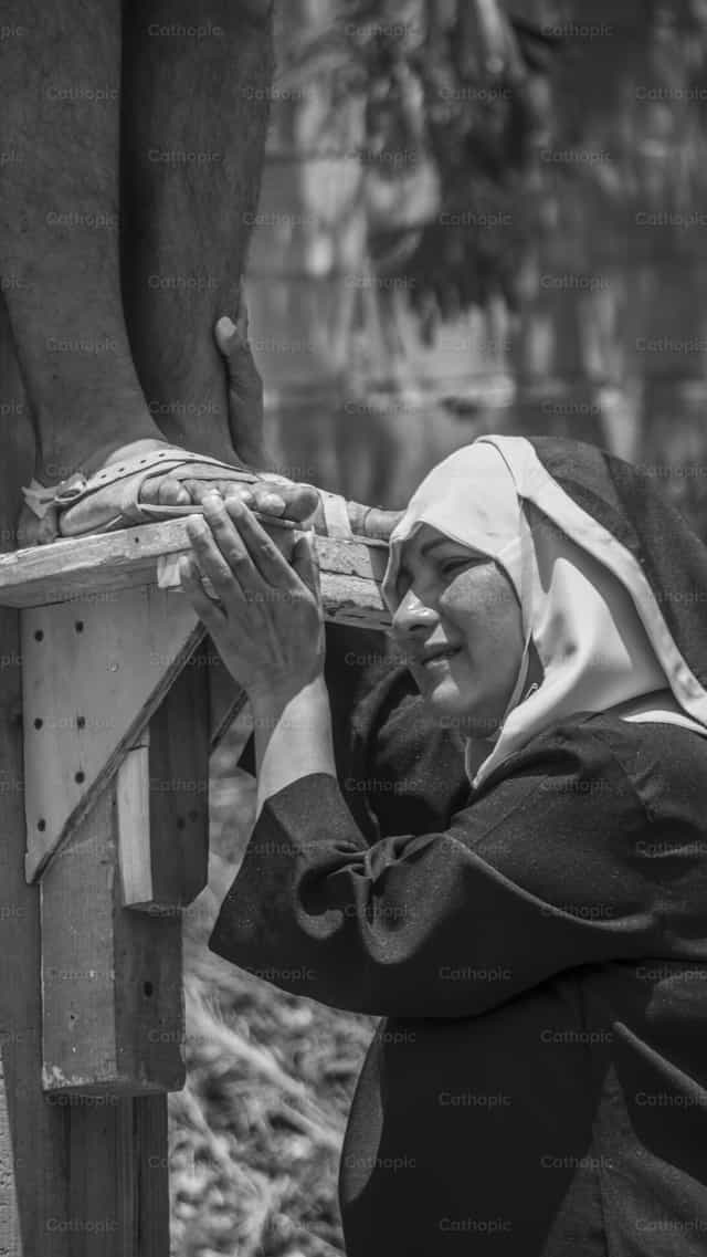 Marie aux pieds de Jésus - Images catholiques de stock