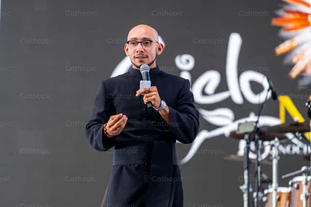 Priest hosting a Catholic event - Catholic stock images - Photo by Hein Palma