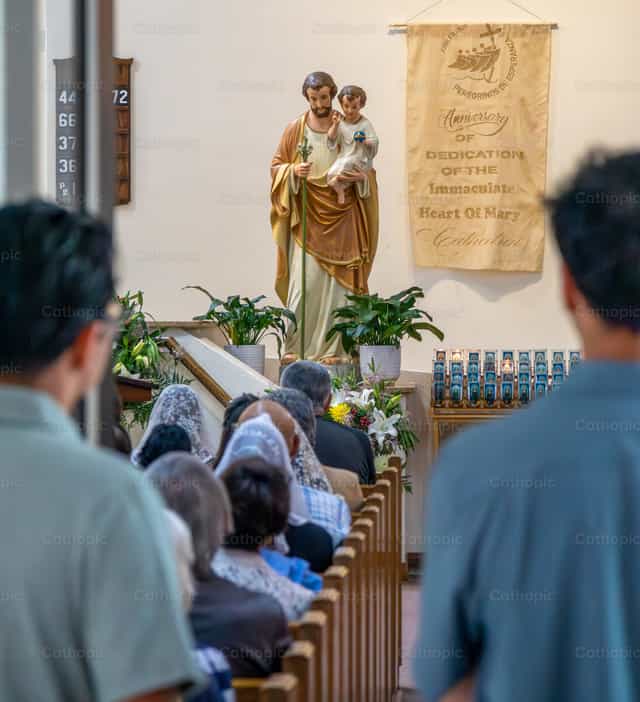 Saint Joseph during Mass - Catholic stock images - Photo by Steven Zimmerman