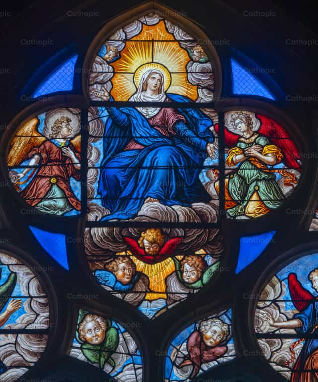 Stained glass window depicts the Assumption of Mary - Catholic stock images