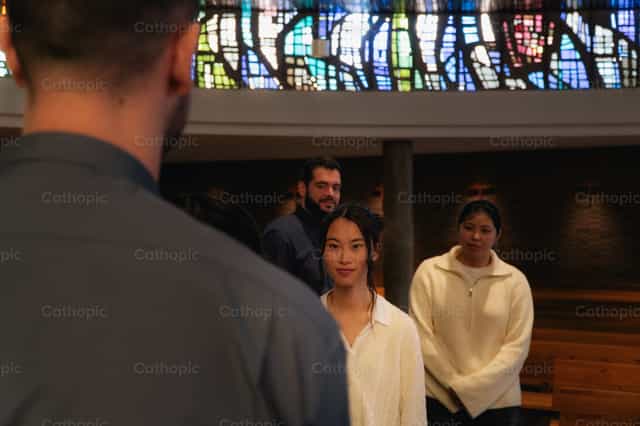 Priest dismissing the young people - Catholic stock images